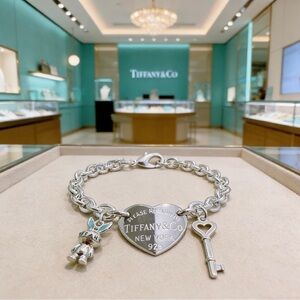 Tiffany & Co. Silver Heart Tag Charm Bracelet with Key and Rabbit
